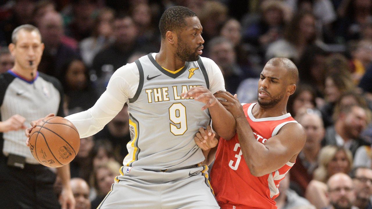 Houston Rockets guard Chris Paul (3) defends Cleveland Cavaliers guard Dwyane Wade (9) during the first half at Quicken Loans Arena