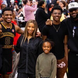 West guard Bronny James (6) poses for a family photo with grandmother Gloria Marie James, mother Savannah James , brother Bryce Maximus James, sister Zhuri Nova James and father LeBron James following the McDonald's All American Boy's high school basketball game at Toyota Center.