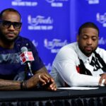 Miami Heat forward LeBron James (6) and guard Dwyane Wade (3) speak during a press conference after game five of the 2014 NBA Finals at AT&T Center.
