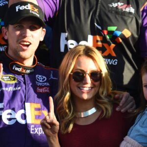 Denny Hamlin (11) reacts with Jordan Fish in victory lane after winning the Daytona 500 at Daytona International Speedway.