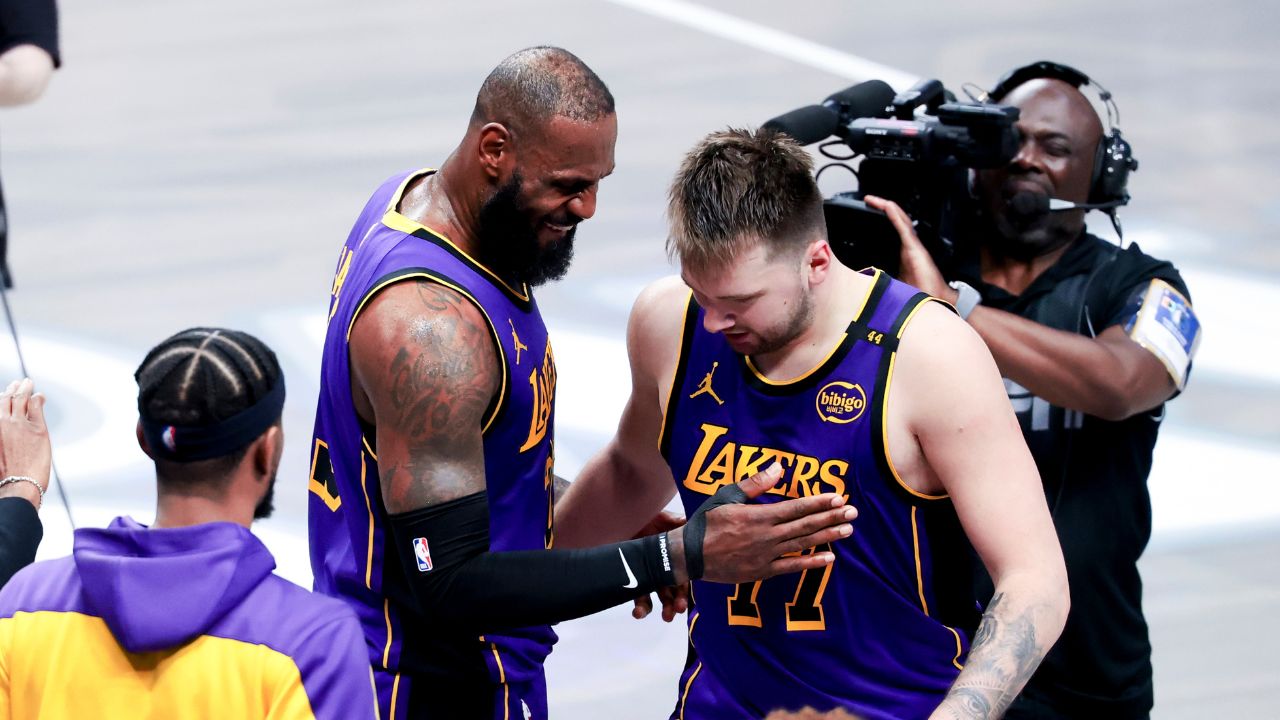 Los Angeles Lakers forward LeBron James (23) celebrates with Los Angeles Lakers guard Luka Doncic (77) during the fourth quarter against the Dallas Mavericks at American Airlines Center