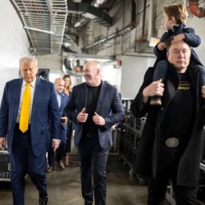 U.S President Donald Trump, left, walks with UFC CEO Dana White, center, and billionaire Elon Musk, right, before the start of the UFC 314 at the Kaseya Center