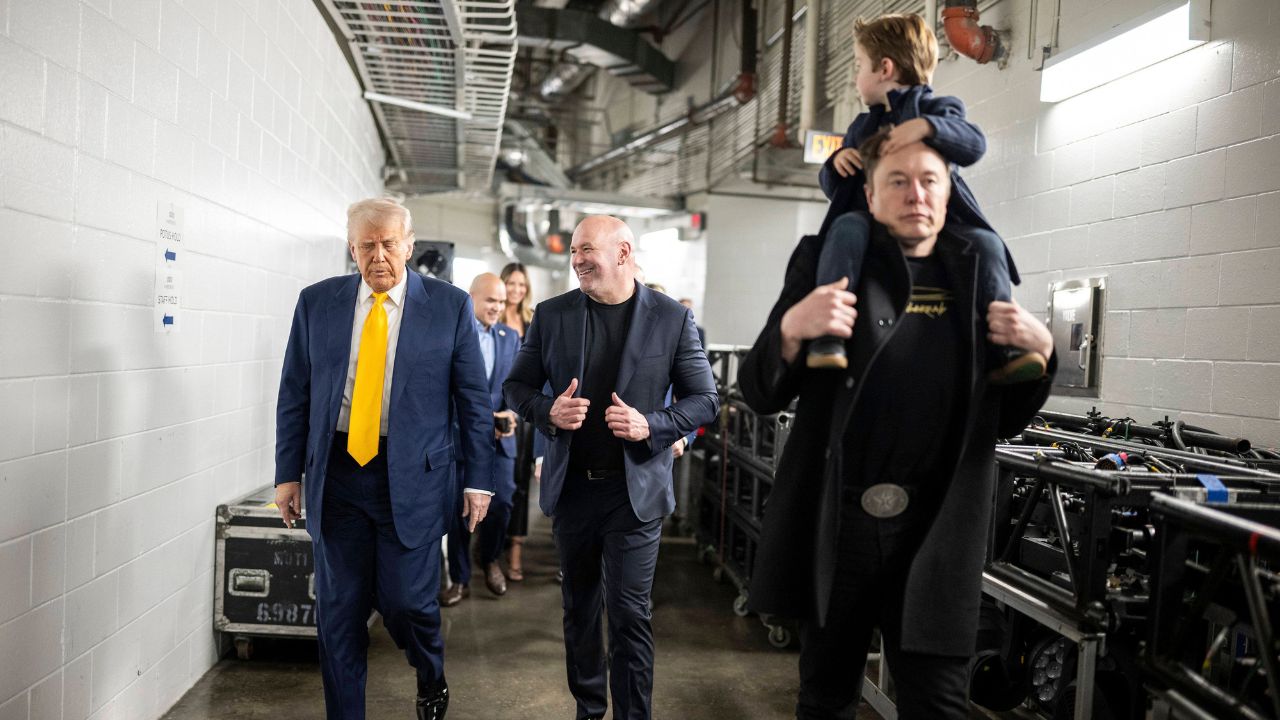 U.S President Donald Trump, left, walks with UFC CEO Dana White, center, and billionaire Elon Musk, right, before the start of the UFC 314 at the Kaseya Center