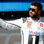 NASCAR Cup Series driver Bubba Wallace (23) walks out onto the stage for driver introductions before the EchoPark Automotive Grand Prix at Circuit of the Americas.
