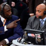 TNT broadcaster Shaquille O'Neal (left) and Charles Barkley talk during the 2013 NBA All-Star slam dunk contest at the Toyota Center