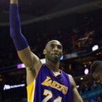 Los Angeles Lakers forward Kobe Bryant (24) waves to the fans after leaving the game late in the fourth quarter against the Charlotte Hornets at Time Warner Cable Arena. The Hornets won 108-98.