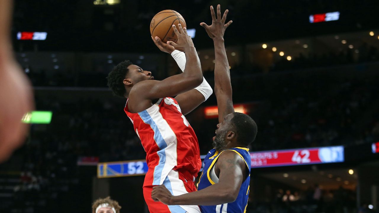Memphis Grizzlies forward Jaren Jackson Jr. (13) shoots as Golden State Warriors forward Draymond Green (23) defends during the second quarter at FedExForum.