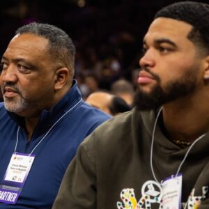 Southern California Trojans quarterback Caleb Williams (right) with father Chuck Williams in attendance during the Phoenix Suns against the Denver Nuggets during game three of the 2023 NBA playoffs at Footprint Center.