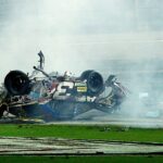 Parts off of NASCAR Sprint Cup Series driver Austin Dillon (3) car tumble through the infield following a crash at the finish to the Coke Zero 400 at Daytona International Speedway. NASCAR Sprint Cup Series driver Dale Earnhardt Jr. (not pictured) won.