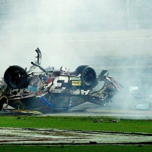 Parts off of NASCAR Sprint Cup Series driver Austin Dillon (3) car tumble through the infield following a crash at the finish to the Coke Zero 400 at Daytona International Speedway. NASCAR Sprint Cup Series driver Dale Earnhardt Jr. (not pictured) won.