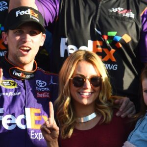 Denny Hamlin (11) reacts with Jordan Fish in victory lane after winning the Daytona 500 at Daytona International Speedway.