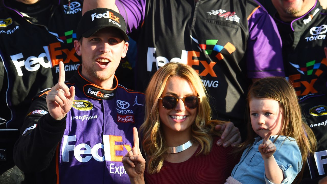 Denny Hamlin (11) reacts with Jordan Fish in victory lane after winning the Daytona 500 at Daytona International Speedway.