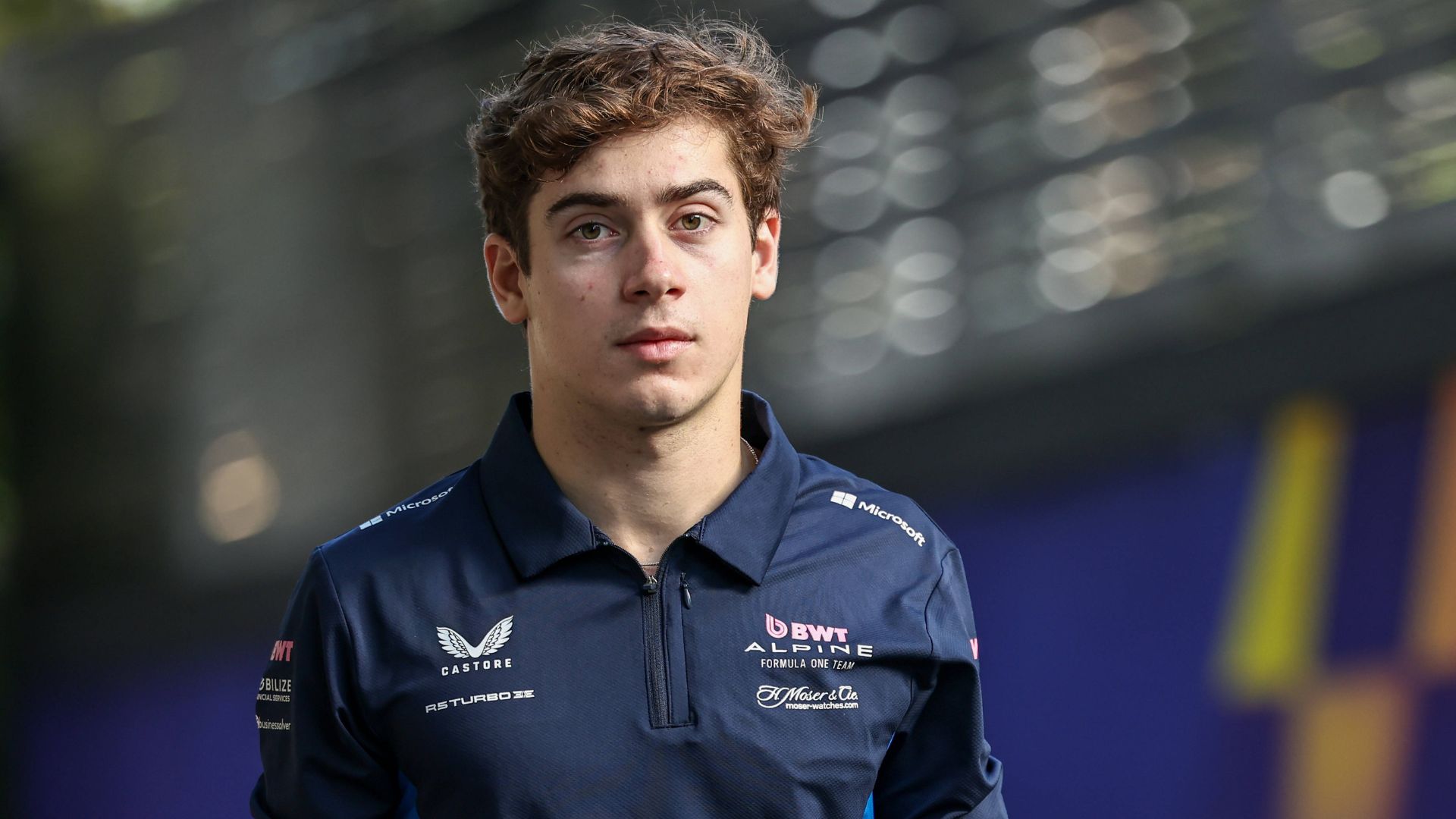 Franco Colapinto of Argentina and the Alpine F1 team walks in the paddock during practice ahead of the F1 Grand Prix of Australia at Albert Park