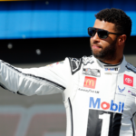 NASCAR Cup Series driver Bubba Wallace (23) walks out onto the stage for driver introductions before the EchoPark Automotive Grand Prix at Circuit of the Americas.