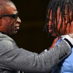 Colorado Buffaloes wide receiver/cornerback Travis Hunter with head coach Deion Sanders after winning the 2024 Heisman Trophy.