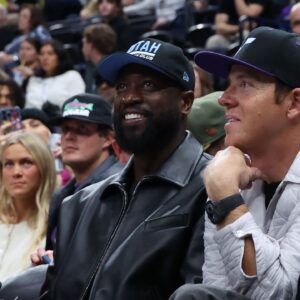 Former NBA player Dwayne Wade and Utah Jazz owner Ryan Smith watch the game between the Utah Jazz and the Phoenix Suns during the fourth quarter at Delta Center.