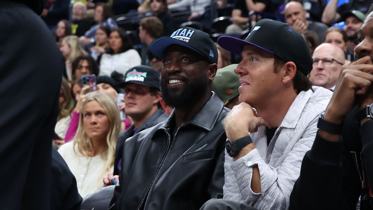 Former NBA player Dwayne Wade and Utah Jazz owner Ryan Smith watch the game between the Utah Jazz and the Phoenix Suns during the fourth quarter at Delta Center.