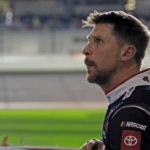 Denny Hamlin gets out of his car and checks out the screen during the Daytona 500 Pole Qualifying at Daytona International Speedway on Wednesday, Feb.12, 2025.