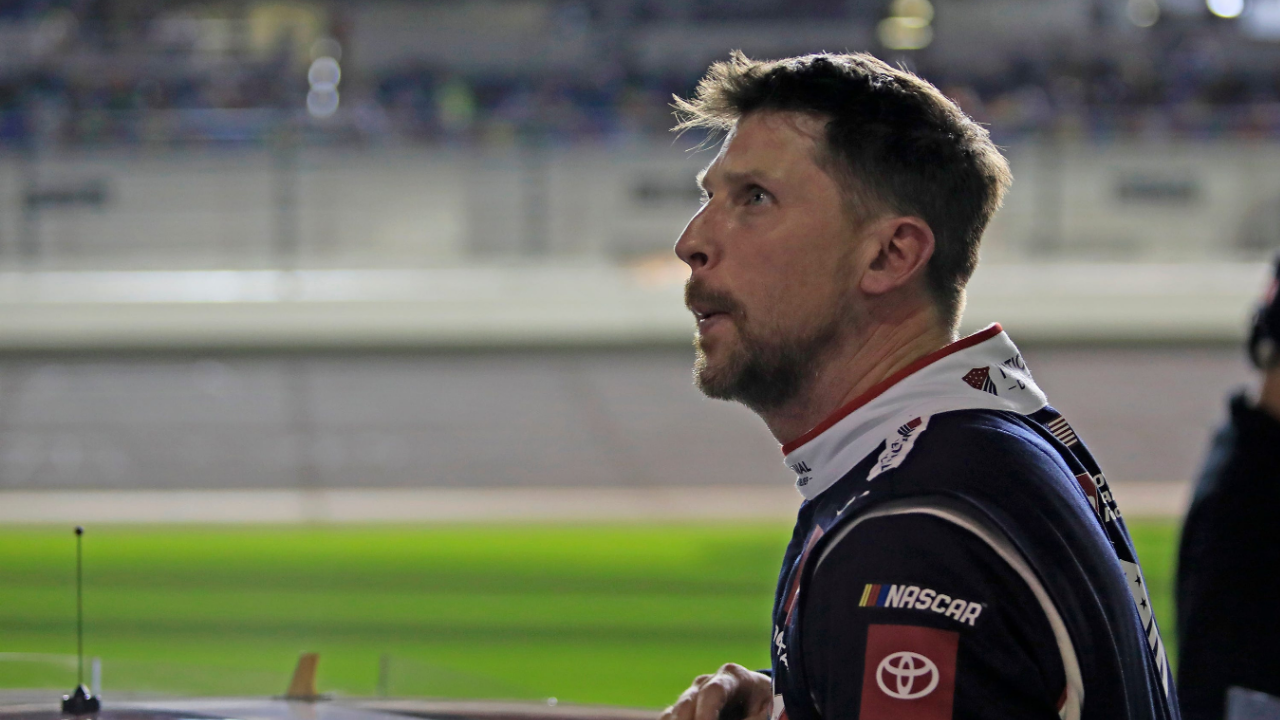 Denny Hamlin gets out of his car and checks out the screen during the Daytona 500 Pole Qualifying at Daytona International Speedway on Wednesday, Feb.12, 2025.