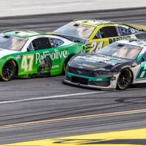 Ricky Stenhouse, Jr. (47) battles Brad Keselowski (6) on the final overtime lap of the YellaWood 500 at Talladega Superspeedway.
