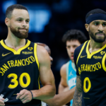 Mar 29, 2024; Charlotte, North Carolina, USA; Golden State Warriors guards Stephen Curry (30) and Gary Payton II look to the bench during a break in the action against the Charlotte Hornets during the first quarter at Spectrum Center.