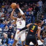 Los Angeles Lakers guard Bronny James (9) passes around Oklahoma City Thunder forward Dillon Jones (3) during the second half at Paycom Center