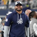 Dallas Cowboys quarterback Dak Prescott (left) stands on crutches before the game against the New York Giants at AT&T Stadium.