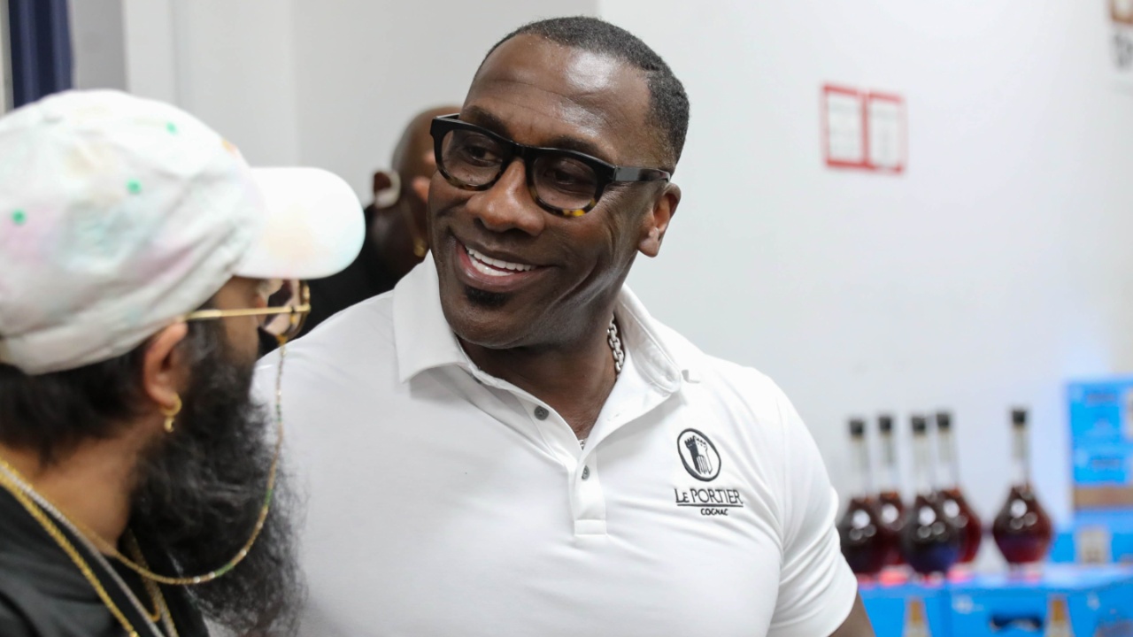 NFL Hall of Famer and former SSU football player Shannon Sharpe talks to a fan from Hinesville, Ga after signing a bottle of his Le Portier Shay VSOP Luxury Cognac at Habersham Beverage Warehouse in Savannah on Thursday, March 19, 2025.