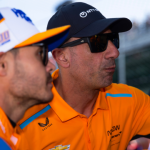 May 24, 2024; Indianapolis, Indiana, USA; Tony Kanaan (right) with IndyCar Series driver Kyle Larson during Carb Day final practice for the Indianapolis 500 at Indianapolis Motor Speedway. Mandatory Credit: Mark J. Rebilas-Imagn Images