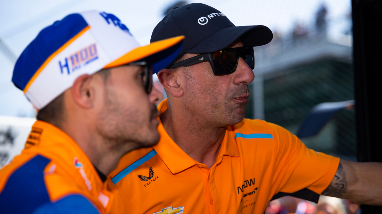 May 24, 2024; Indianapolis, Indiana, USA; Tony Kanaan (right) with IndyCar Series driver Kyle Larson during Carb Day final practice for the Indianapolis 500 at Indianapolis Motor Speedway. Mandatory Credit: Mark J. Rebilas-Imagn Images