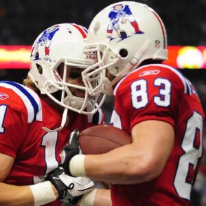 New England Patriots wide receiver Wes Welker (83) celebrates with teammate Julian Edelman (11) after scoring a touchdown during the fourth quarter against the Detroit Lions at Ford Field.