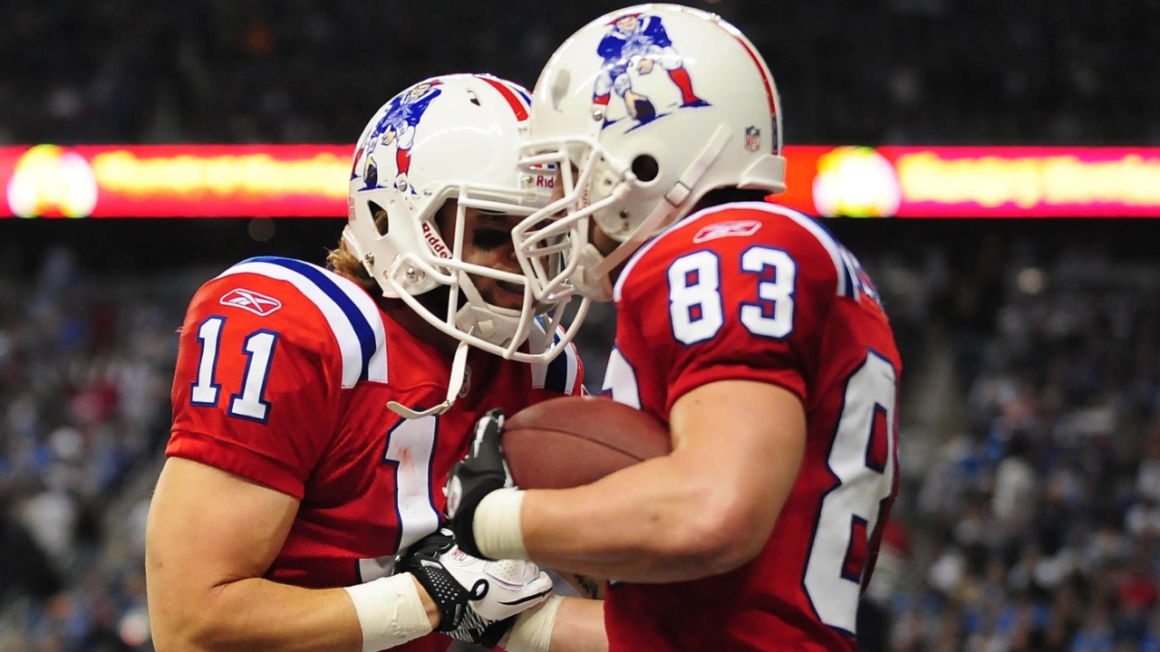 New England Patriots wide receiver Wes Welker (83) celebrates with teammate Julian Edelman (11) after scoring a touchdown during the fourth quarter against the Detroit Lions at Ford Field.