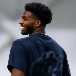 Apr 4, 2025; Boulder, CO, USA; Colorado Buffaloes quarterback Shedeur Sanders (2) laughs during the University of Colorado NFL Showcase at the CU Indoor Practice Facility.