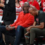 Former Houston Rockets Hakeem Olajuwon (left) sits courts side during the game between the Houston Cougars and the Memphis Tigers at Fertitta Center.