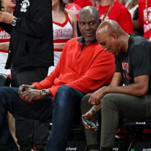 Former Houston Rockets Hakeem Olajuwon (left) sits courts side during the game between the Houston Cougars and the Memphis Tigers at Fertitta Center.