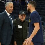 Charlotte Hornets color commentator Dell Curry (left) talks with Golden State Warriors guard Stephen Curry (right) before the game at Chase Center.