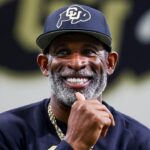 Colorado Buffaloes head coach Deion Sanders watches as his players go through drills at the University of Colorado NFL Showcase at the CU Indoor Practice Facility.
