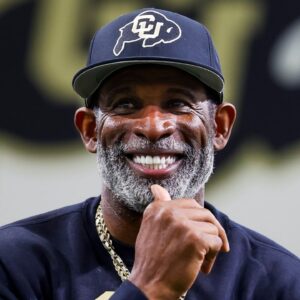 Colorado Buffaloes head coach Deion Sanders watches as his players go through drills at the University of Colorado NFL Showcase at the CU Indoor Practice Facility.