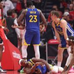 Apr 23, 2025; Houston, Texas, USA; Golden State Warriors forward Jimmy Butler III (10) suffers an apparent injury during the first quarter during game two of the first round for the 2024 NBA Playoffs against the Houston Rockets at Toyota Center.