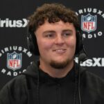 Michigan defensive lineman Mason Graham (DL11) on the SiriusXM radio set during the 2025 NFL Scouting Combine at the Indiana Convention Center.