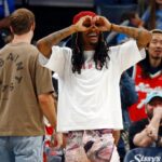 Memphis Grizzlies guard Ja Morant (12) reacts to an assist by guard Yuki Kawamura (not pictured) during the second quarter against the Dallas Mavericks at FedExForum