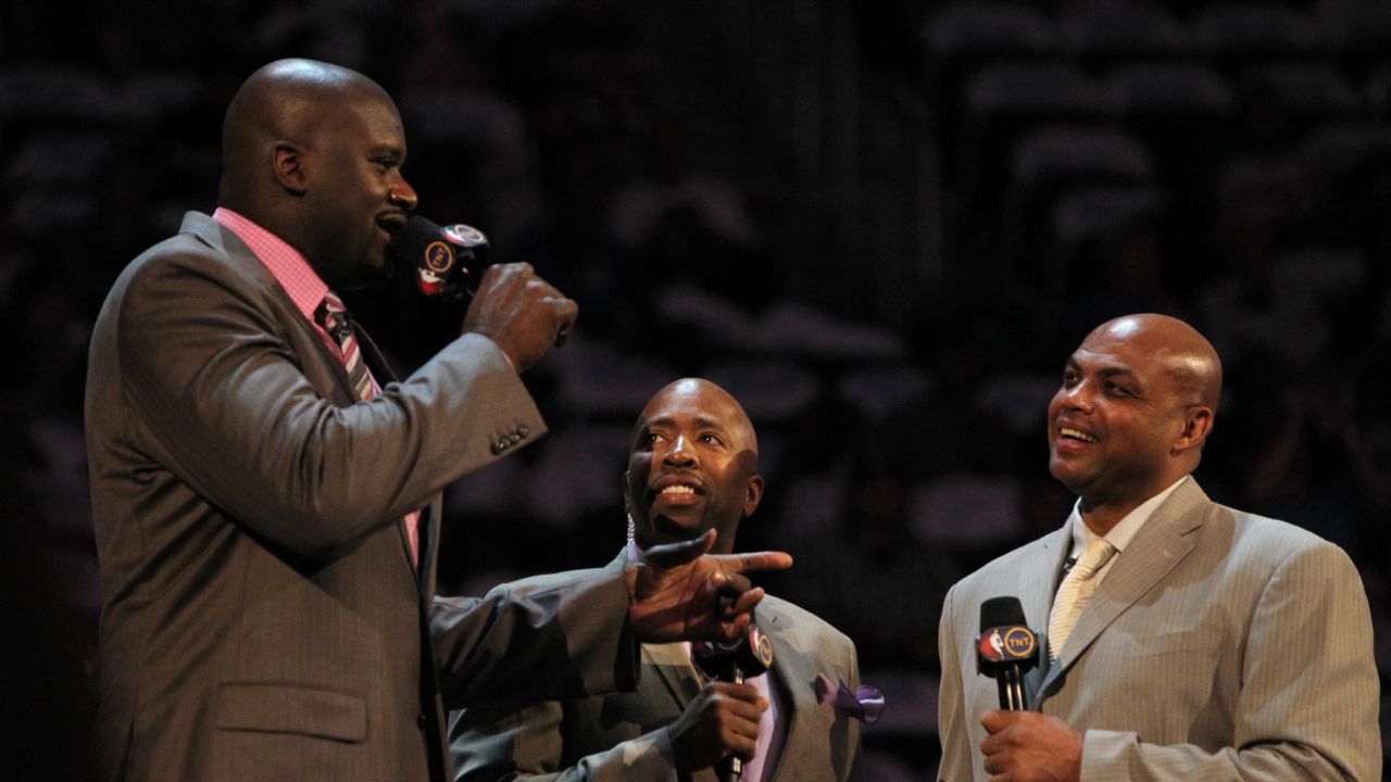 TNT anchor Kenny Smith introduces Team Shaq general manager Shaquille O'Neal and Team Chuck general manager Charles Barkley before the BBVA rising stars challenge at the Amway Center in Orlando.