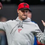 Atlanta Falcons quarterback Kirk Cousins (18) warms up on the field prior to the game against the New York Giants at Mercedes-Benz Stadium.