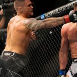 Dustin Poirier punches Michael Chandler in their Lightweight fight during the UFC 281 event at Madison Square Garden
