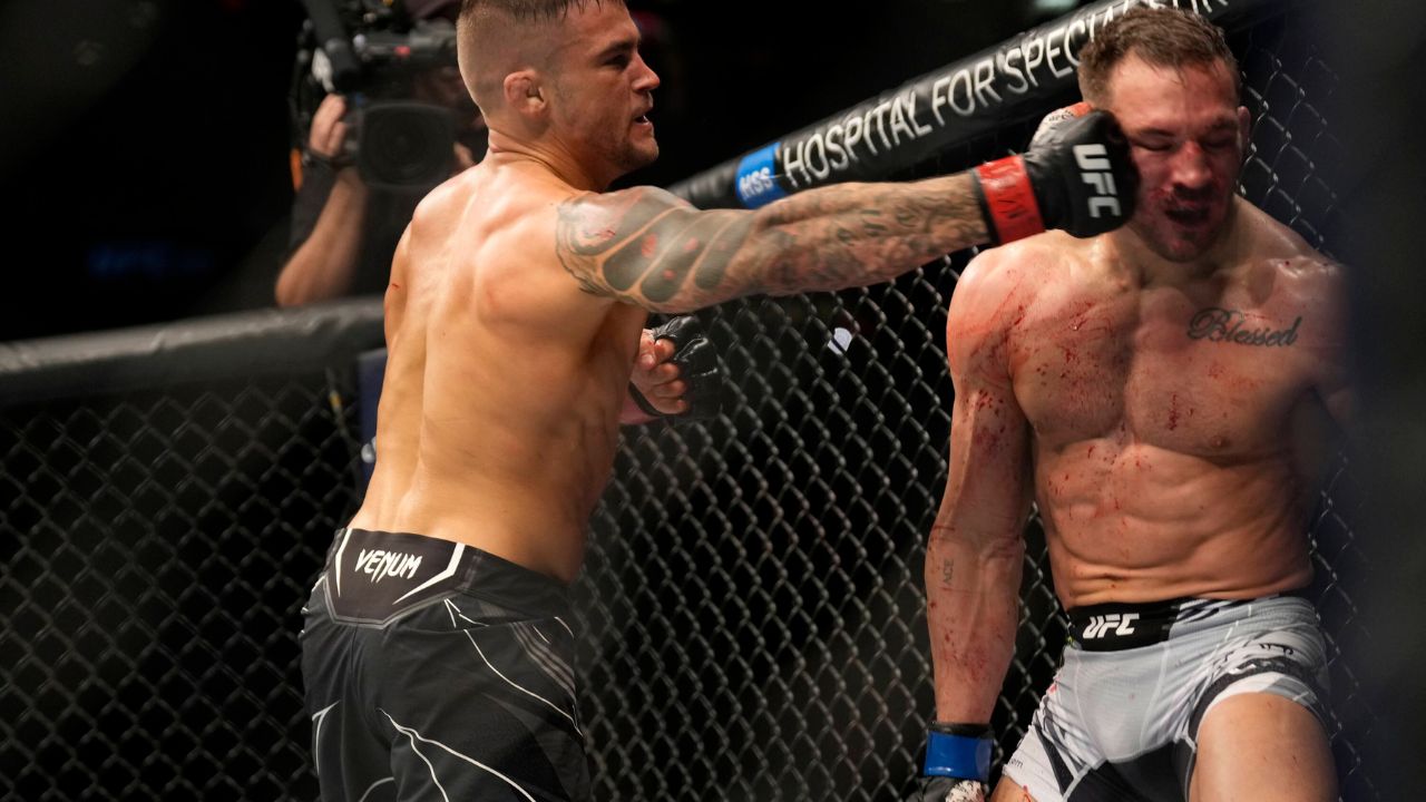 Dustin Poirier punches Michael Chandler in their Lightweight fight during the UFC 281 event at Madison Square Garden