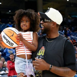 Former basketball player Dwyane Wade attends a WNBA game between the Chicago Sky and Connecticut Sun at Wintrust Arena.