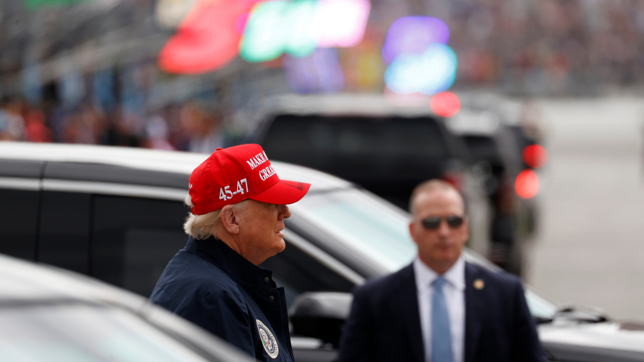 Feb 16, 2025; Daytona Beach, Florida, USA; President Donald Trump arrives in the infield before the Daytona 500 at Daytona International Speedway. Mandatory Credit: Peter Casey-Imagn Images