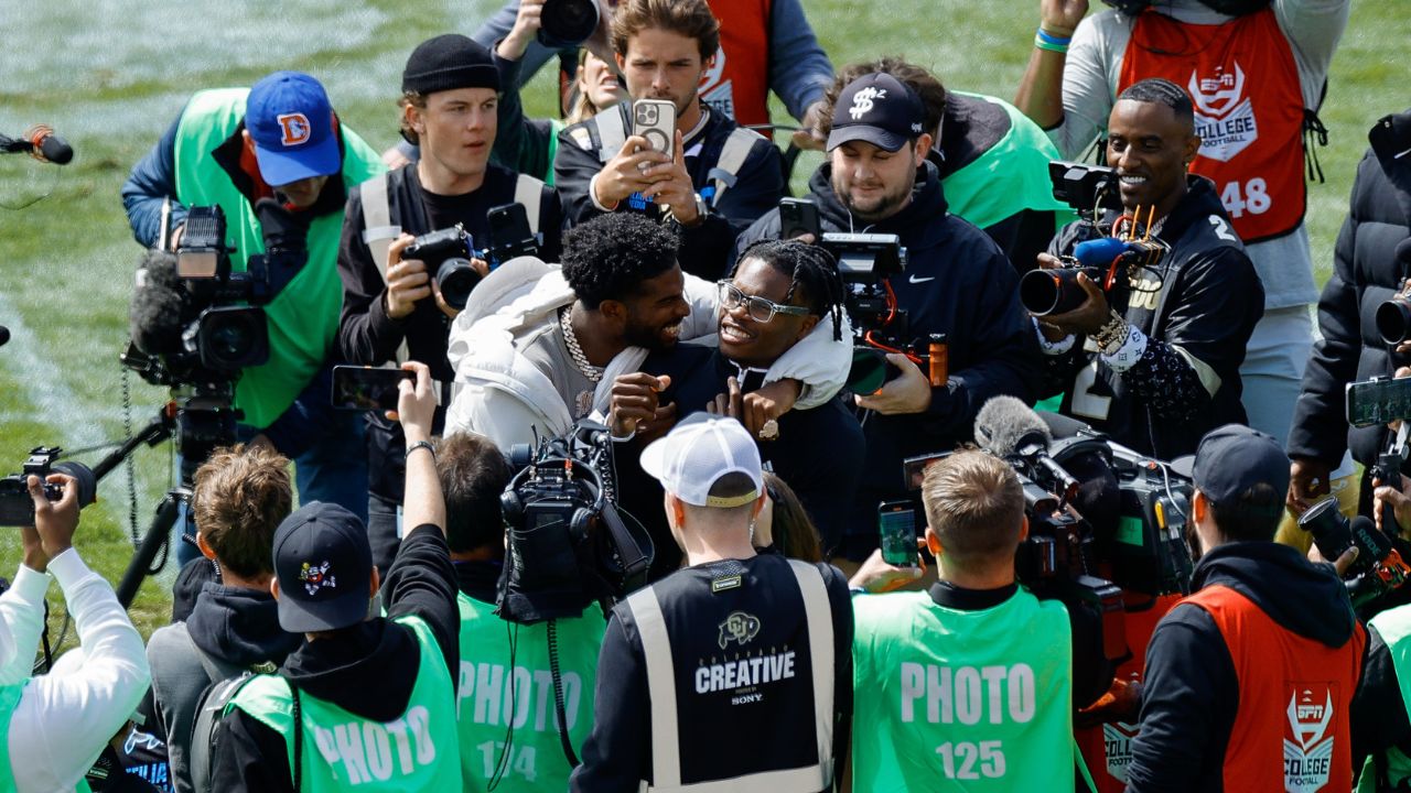 Former Colorado Buffaloes players Shedeur Sanders (L) and Travis Hunter (R) during their number retirement ceremony before the spring game at Folsom Field.
