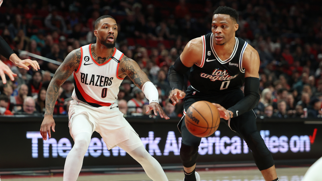 LA Clippers guard Russell Westbrook (0) drives the lane against Portland Trail Blazers guard Damian Lillard
