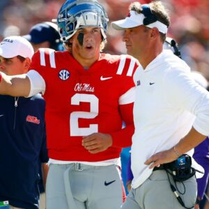 Mississippi Rebels quarterback Jaxson Dart (2) talks with Mississippi Rebels head coach Lane Kiffin during the first half against the Middle Tennessee Blue Raiders at Vaught-Hemingway Stadium.